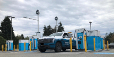 A BC Hydro branded electric F-150 Lightning charging at one of BC Hydro's public fast charging sites.